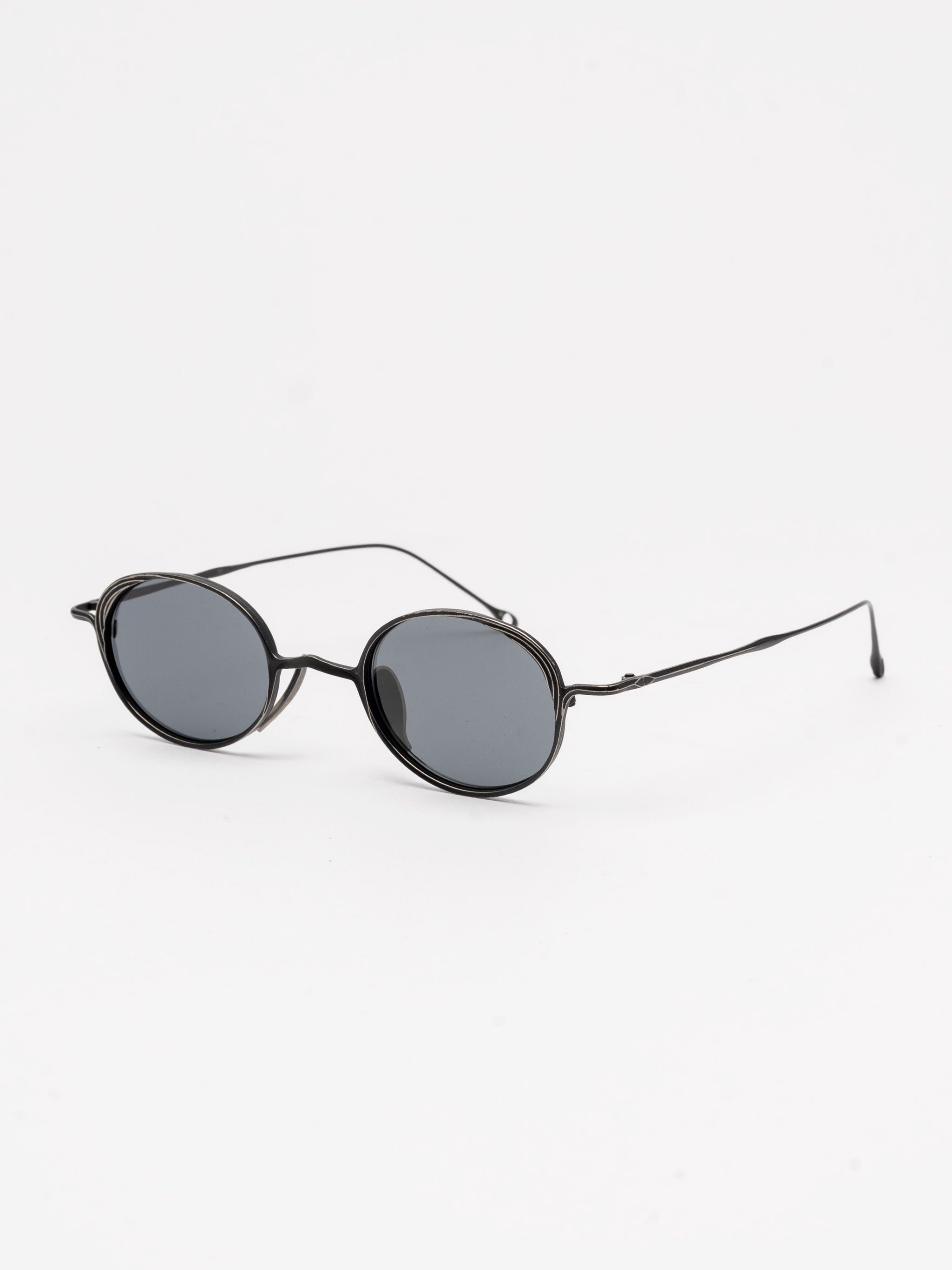 Oval Titanium Sunglasses