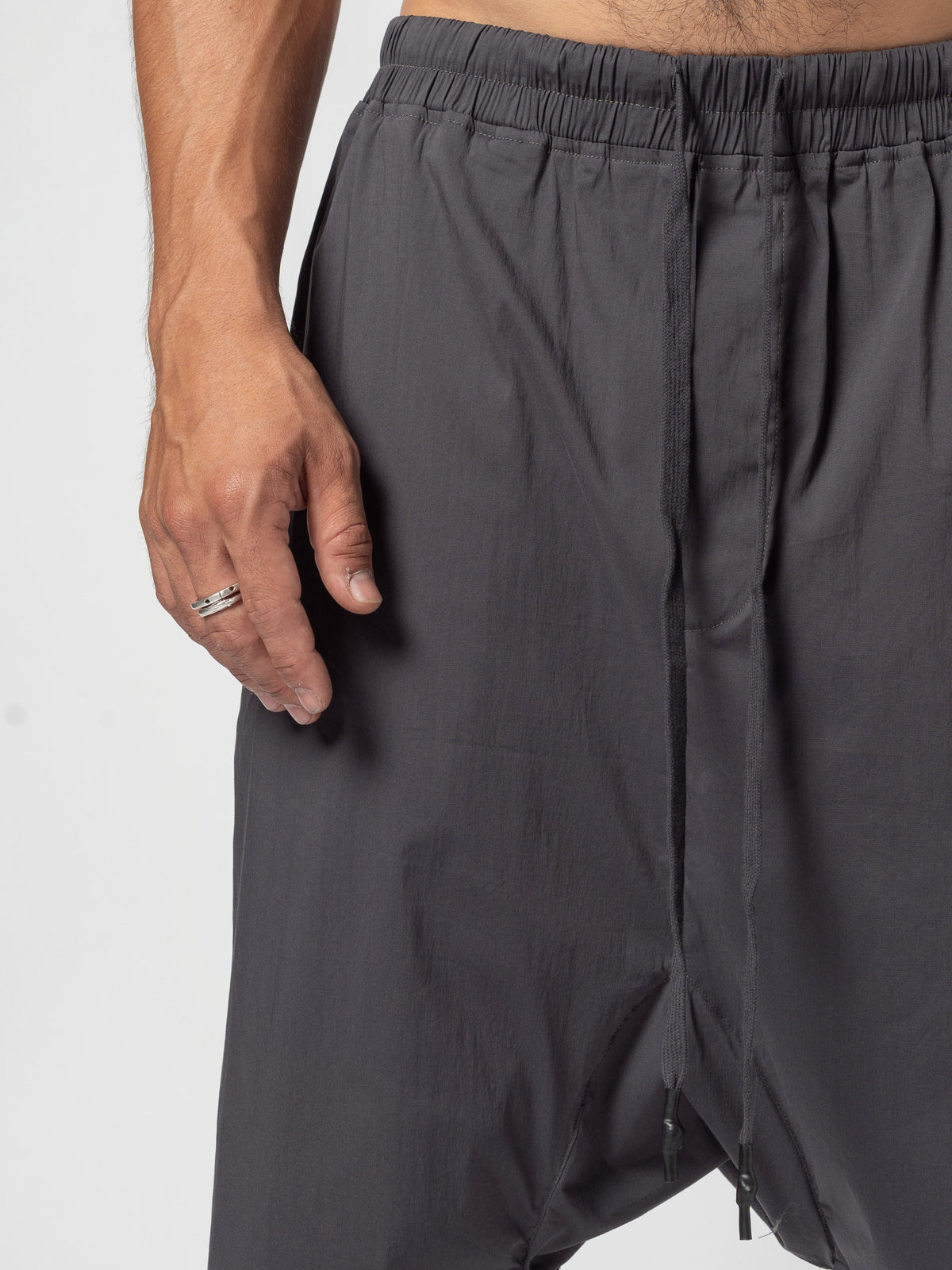 AITO Drop-Crotch Cotton Shorts in Dark Grey - close crop of the gathered elastic waistband with the drawcord tied at the front