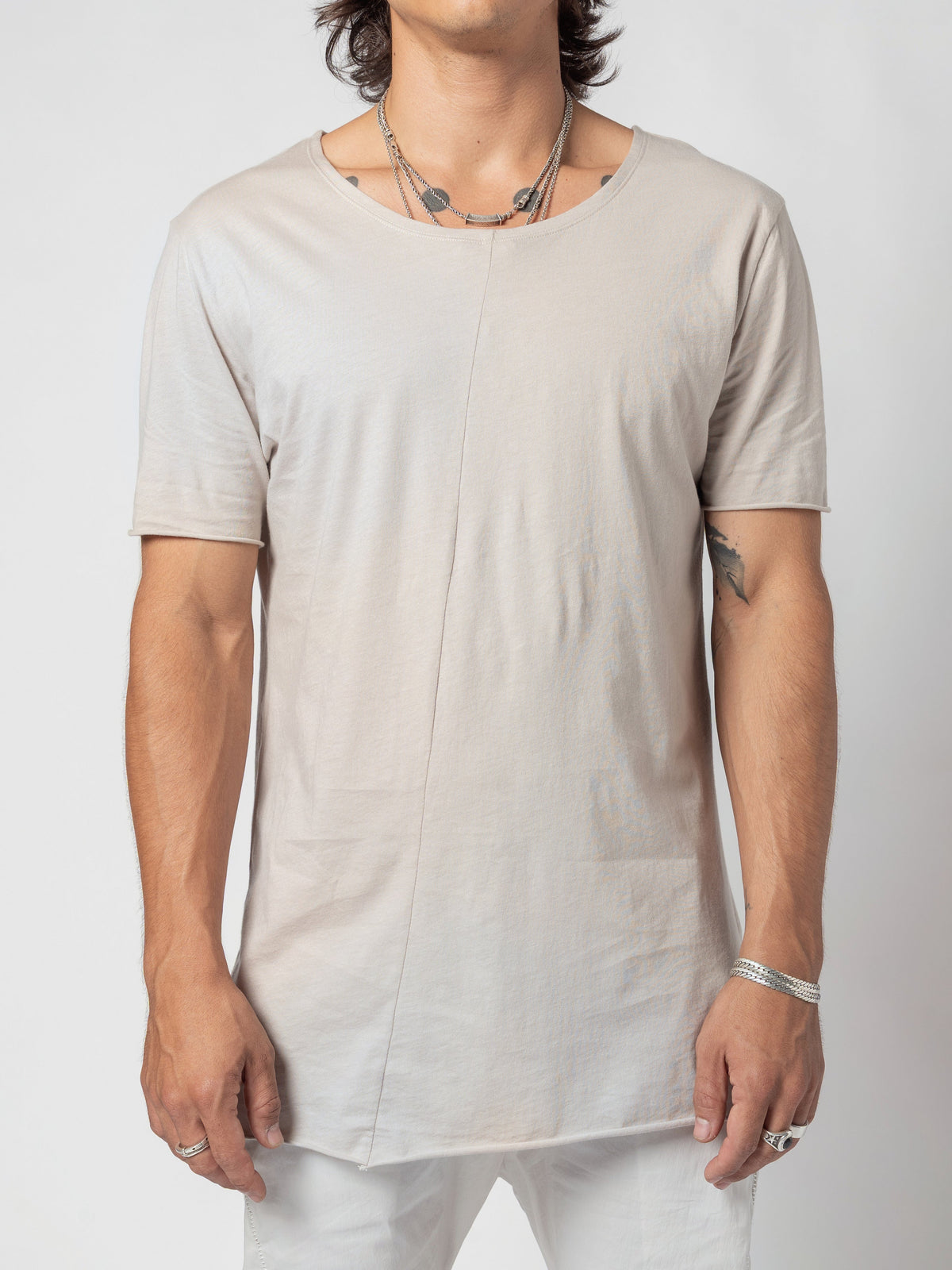 AITO Scoop Neck Cotton T-Shirt in Off White - front view from the chin to the hip, arms at the sides, centre-front seam running down the body
