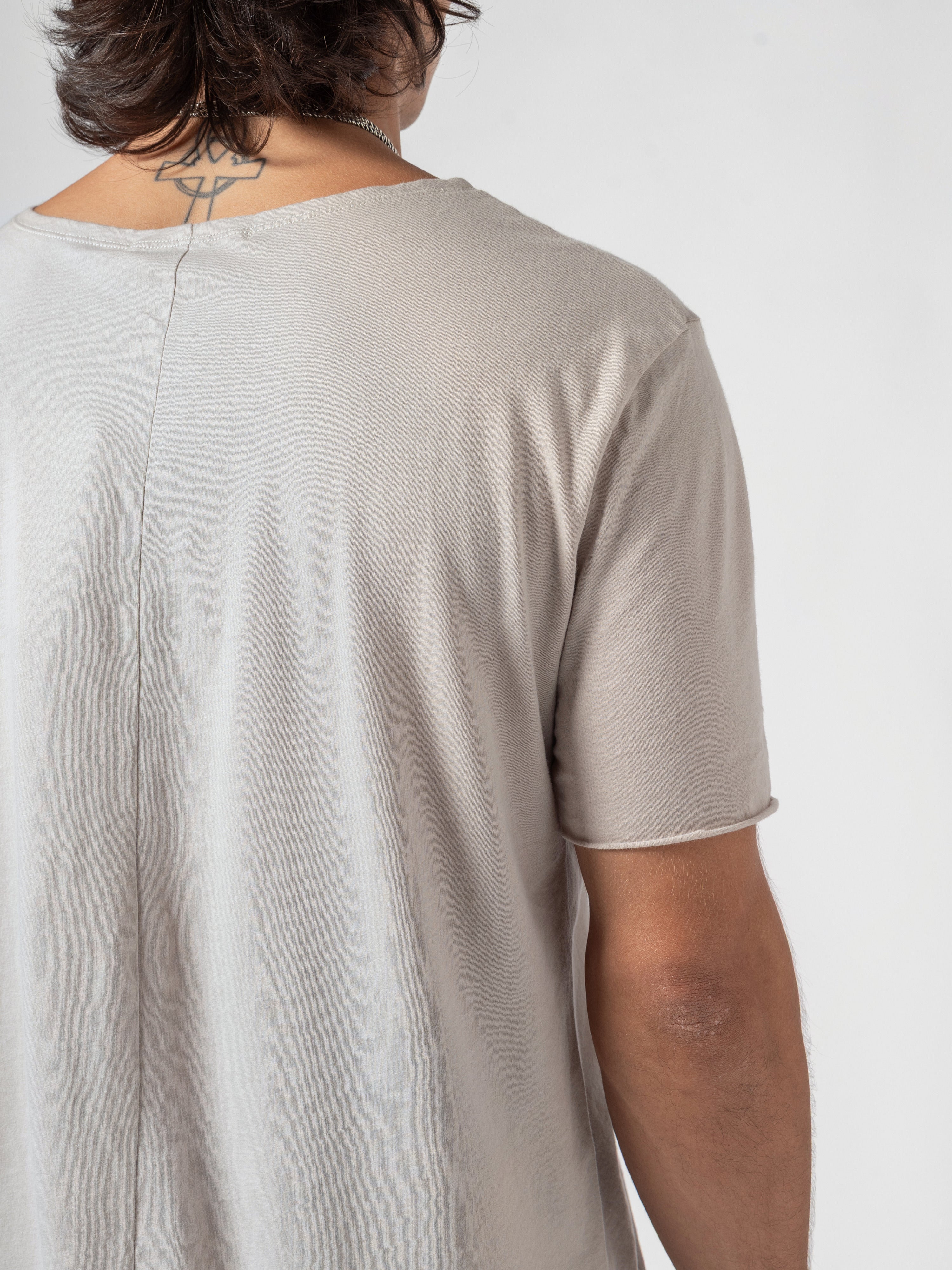 AITO Scoop Neck Cotton T-Shirt in Off White - tighter close-up of the centre-back seam with one sleeve opening beside it