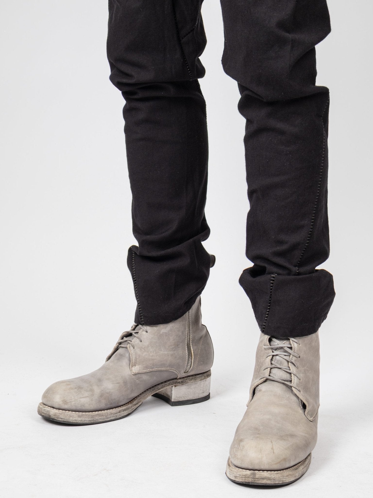 Isaac Sellam LC4 pants leg detail - tapered drop-crotch with leather trim accent