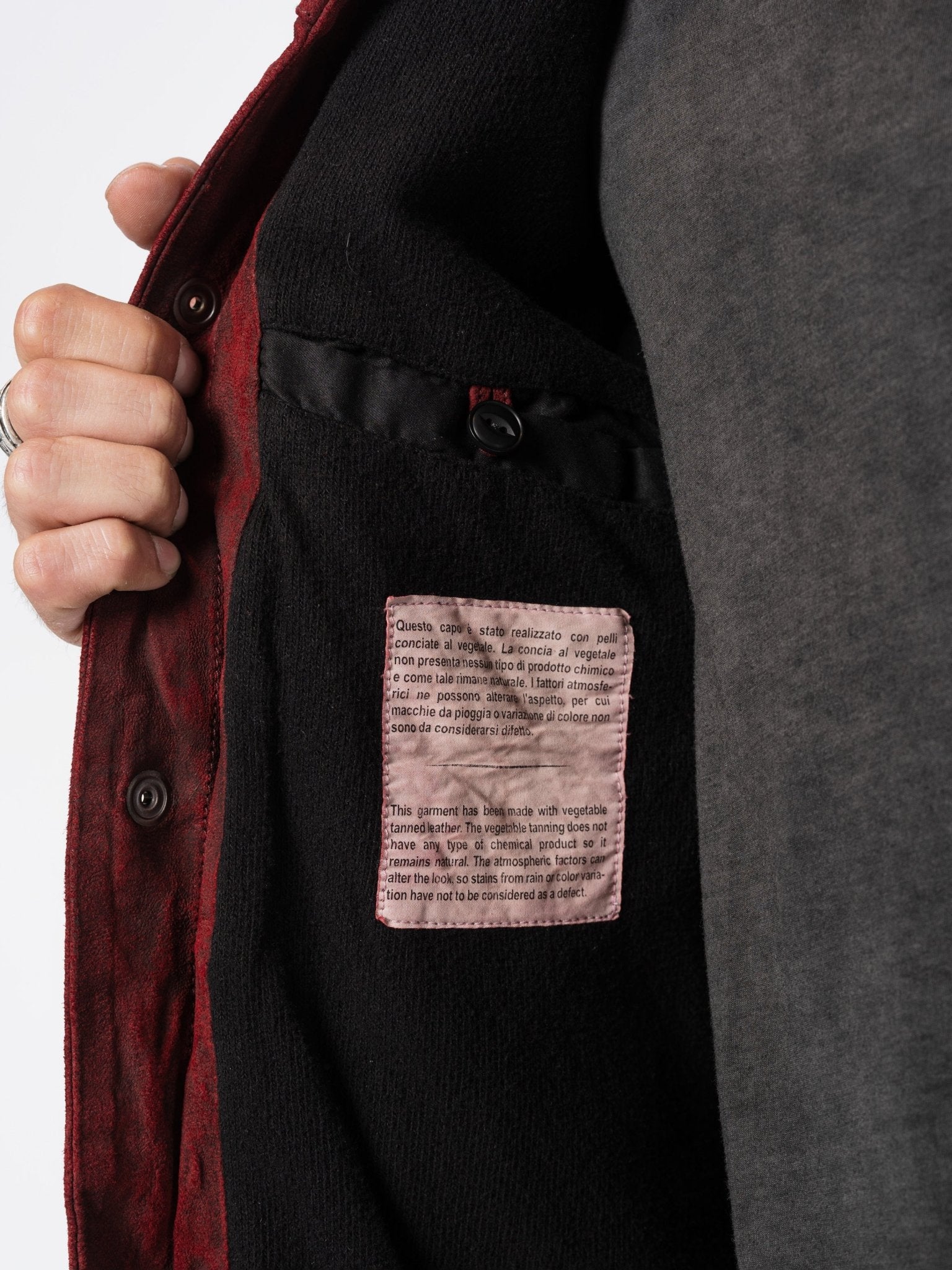 Giorgio Brato leather jacket interior - black lining with vegetable-tanned leather care label detail