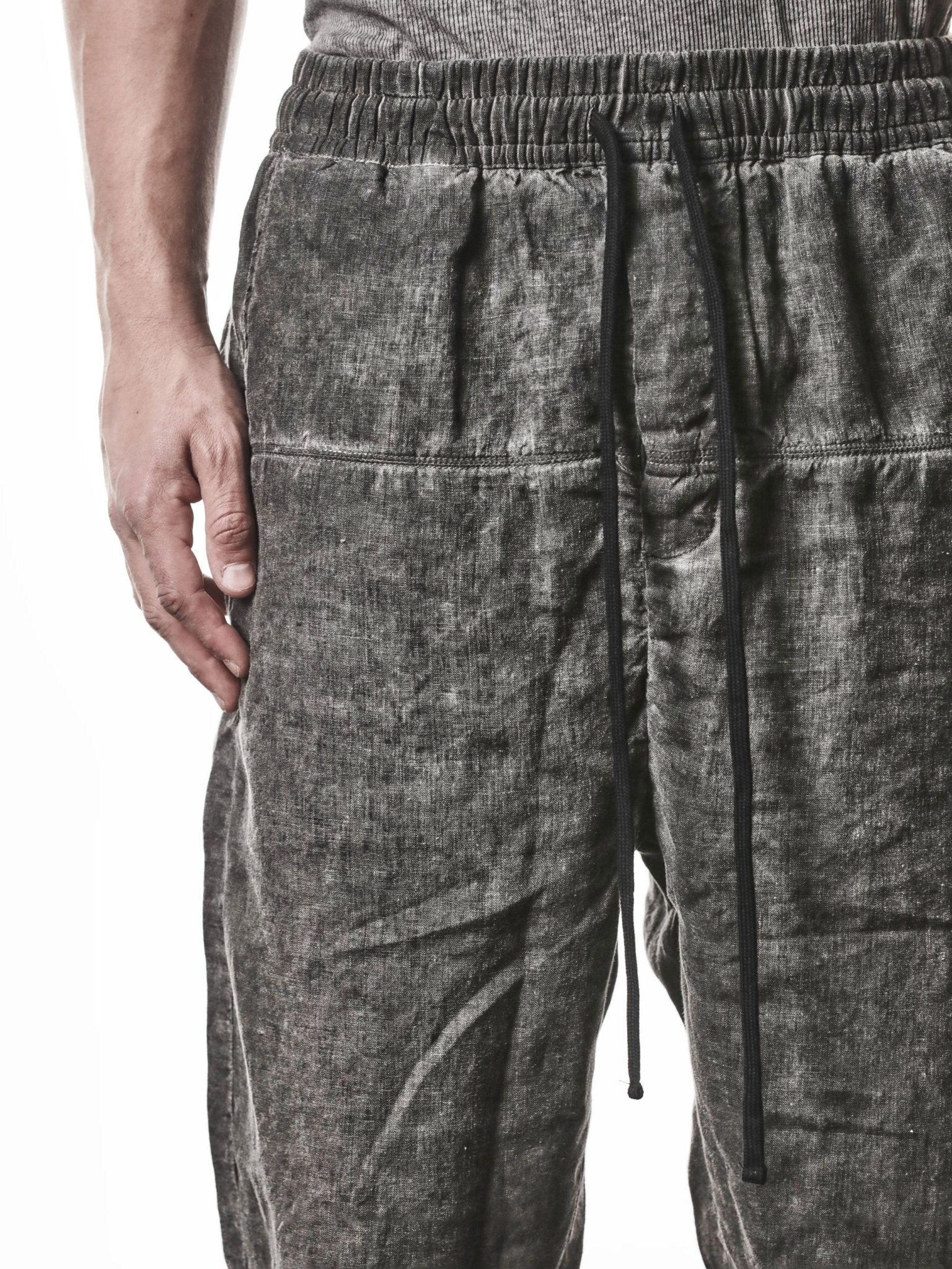 THOM KROM MP49 Cropped Linen Trousers in vegetal black - full length on model